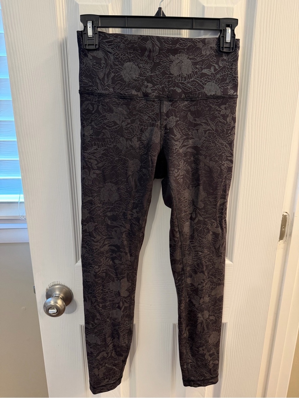 Lululemon wunder train leggings, black with foil flowers, size 6.